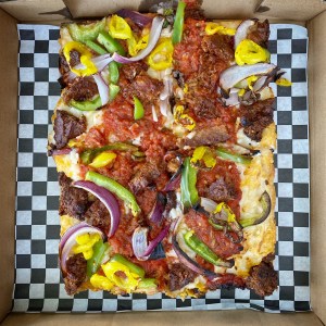 Guerrilla Pizza serves Detroit vegan pizza in Las Vegas. For more vegan pizza options in Las Vegas, visit www.vegansbaby.com