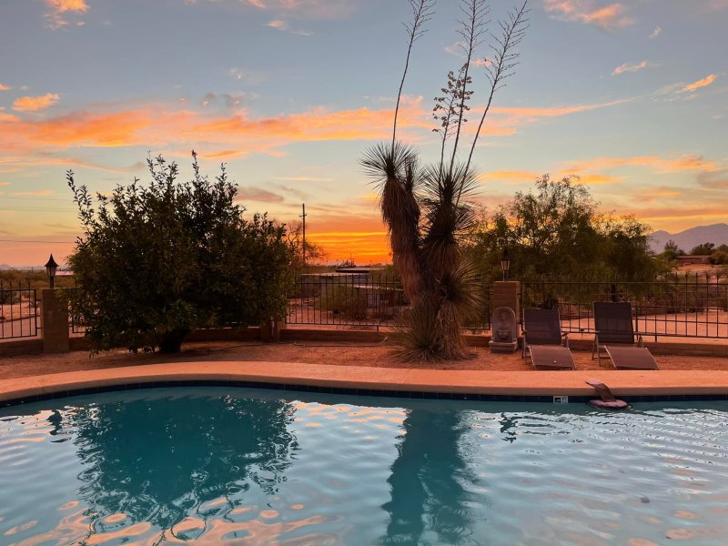 Sunset over the pool at Rancho Vegan, a vegan inn located in Tucson, Arizona